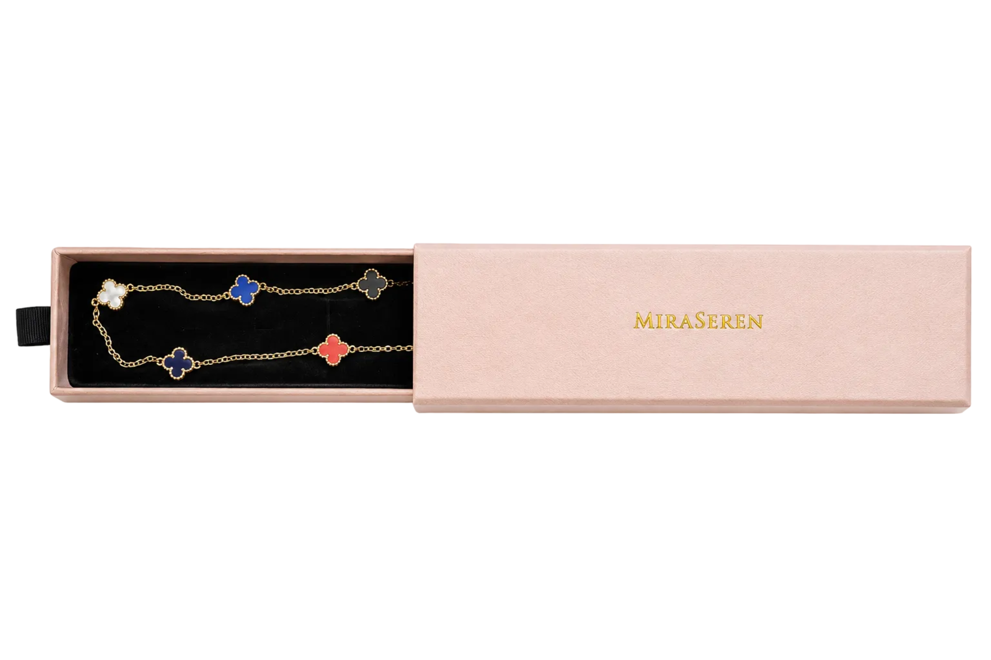 A Miraseren gold chain necklace with four clover-shaped charms in white, blue, red, and gold, presented in an open pink gift box with its lid beside it.