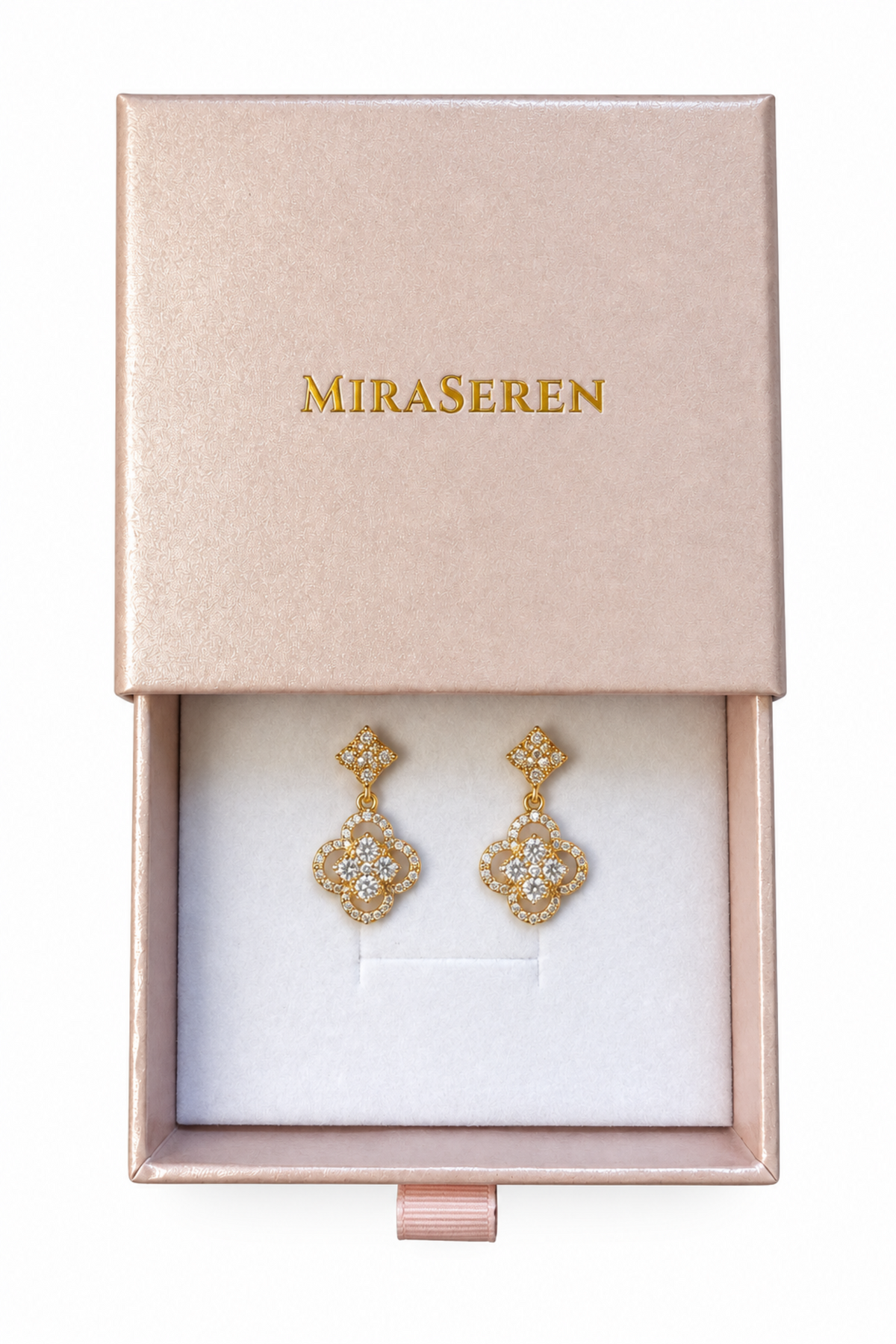 A pair of gold-toned diamond drop earrings displayed inside an open rose gold Miraseren jewelry box on a white background.