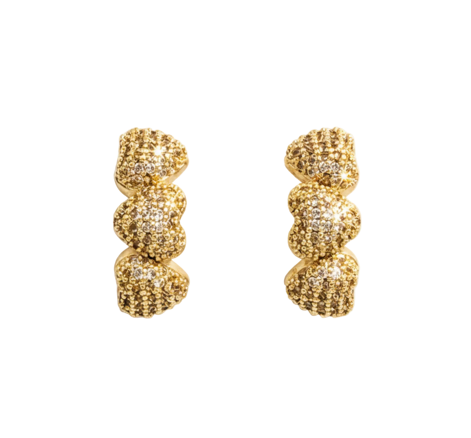 A pair of gold huggie hoop earrings with a textured, glittery, organic wavy pattern, displayed on a clean white background.