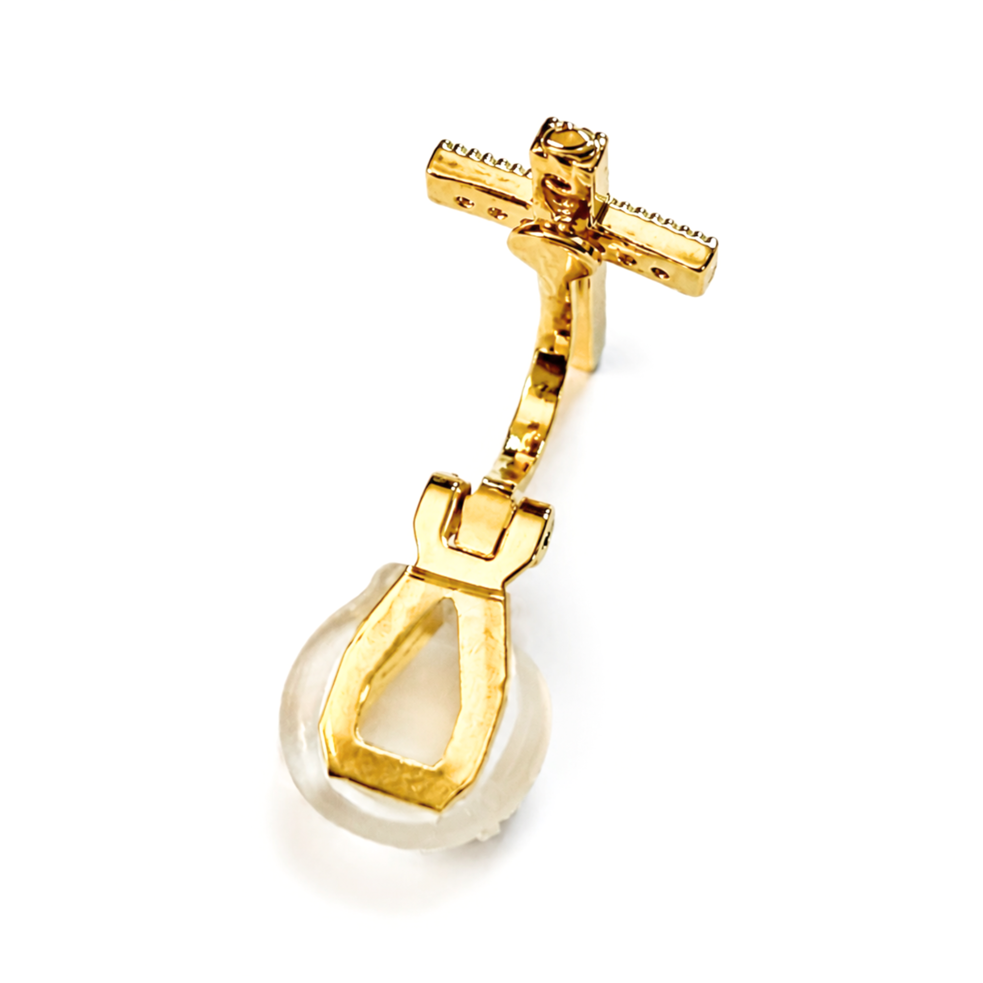 A gold-toned crucifix pendant with a clear glass or acrylic orb at the bottom, photographed on a clean white background.