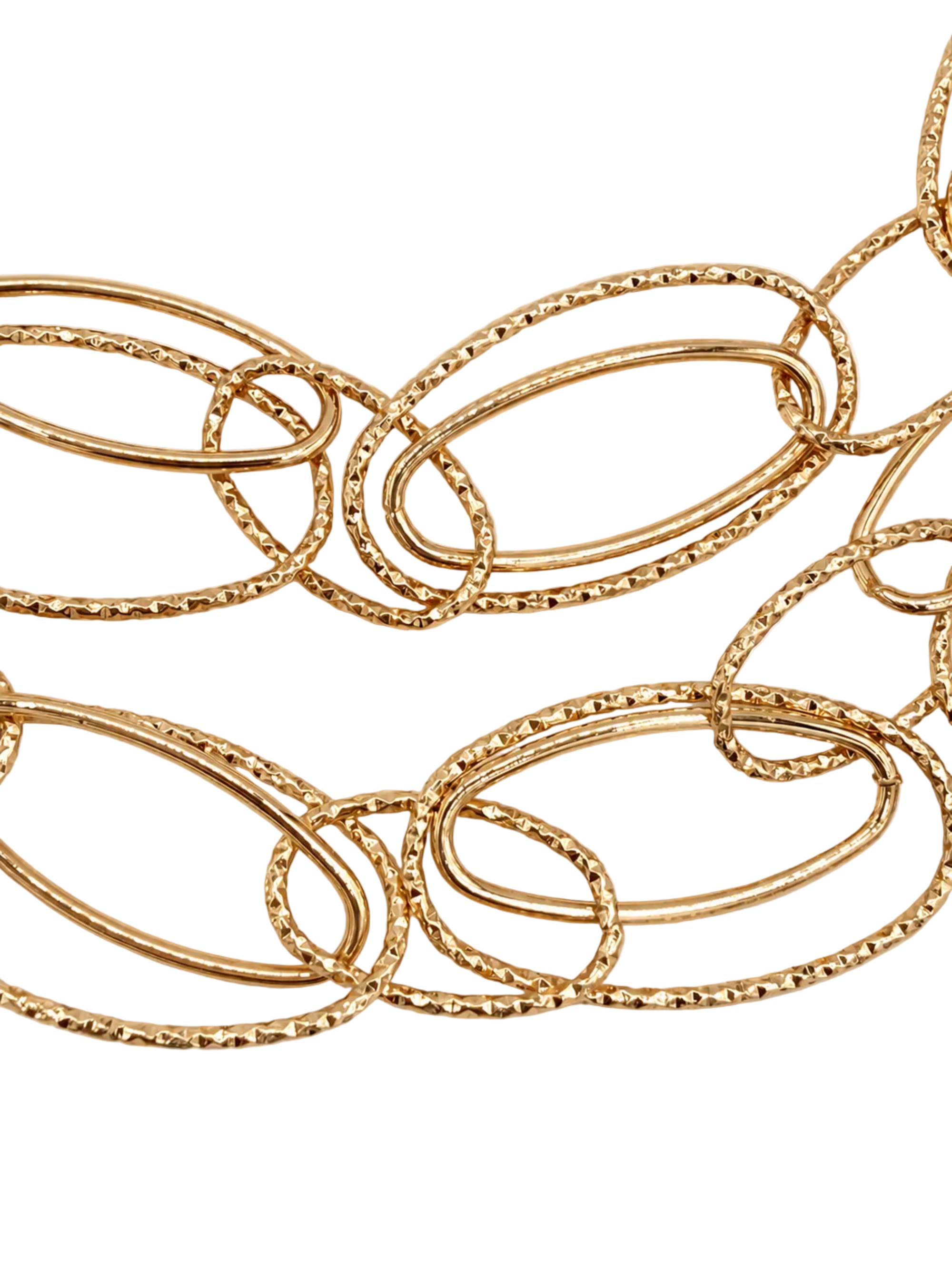 A close-up of a gold-toned chain necklace with large, overlapping textured oval links on a plain off-white background.