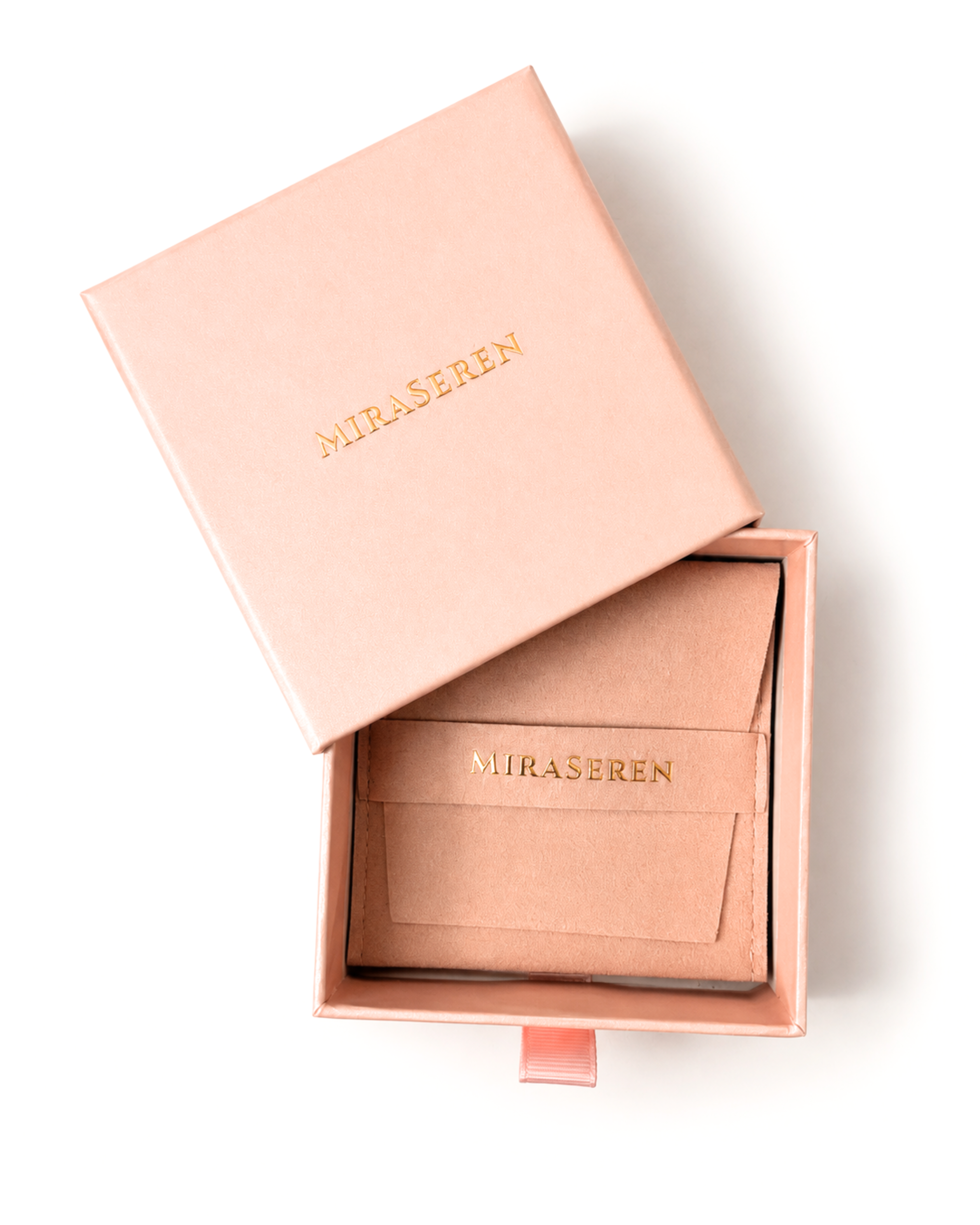 A rose gold Miraseren jewelry box shown open with its lid propped beside it, revealing a matching interior card and box lining with gold Miraseren branding, on a clean white background.