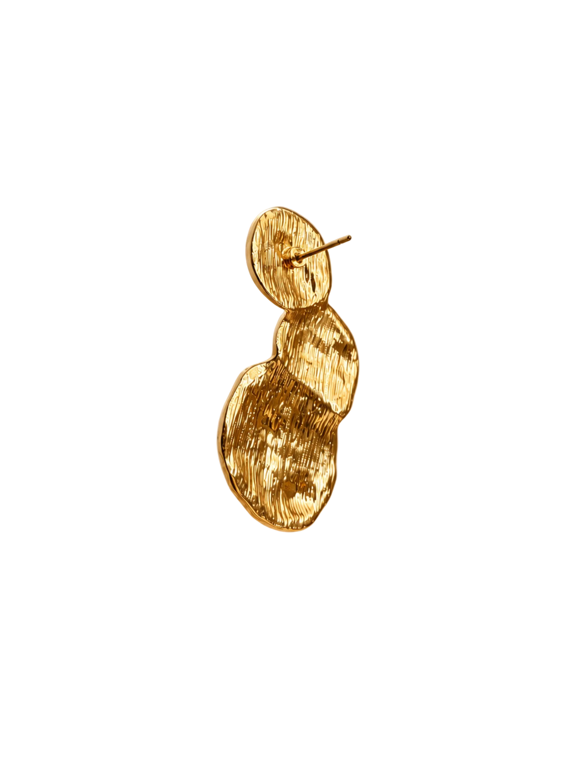 A single gold textured drop earring with a circular disc design and a post, shown against a warm beige background with soft light rays.