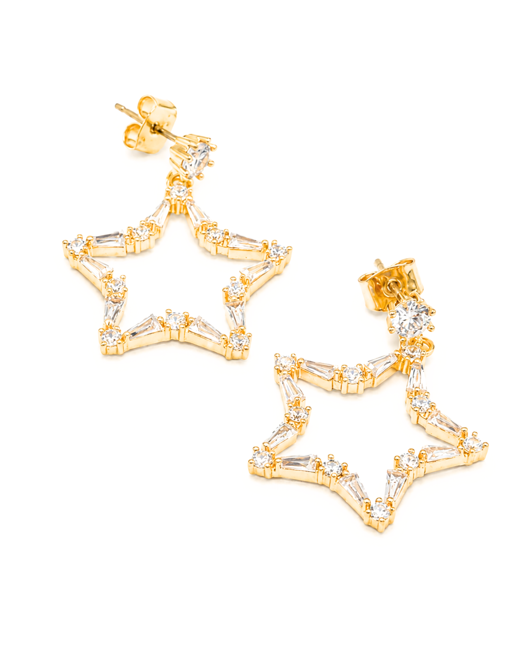 A pair of gold star-shaped dangle earrings embellished with clear baguette and round crystals, shown on a plain white background.
