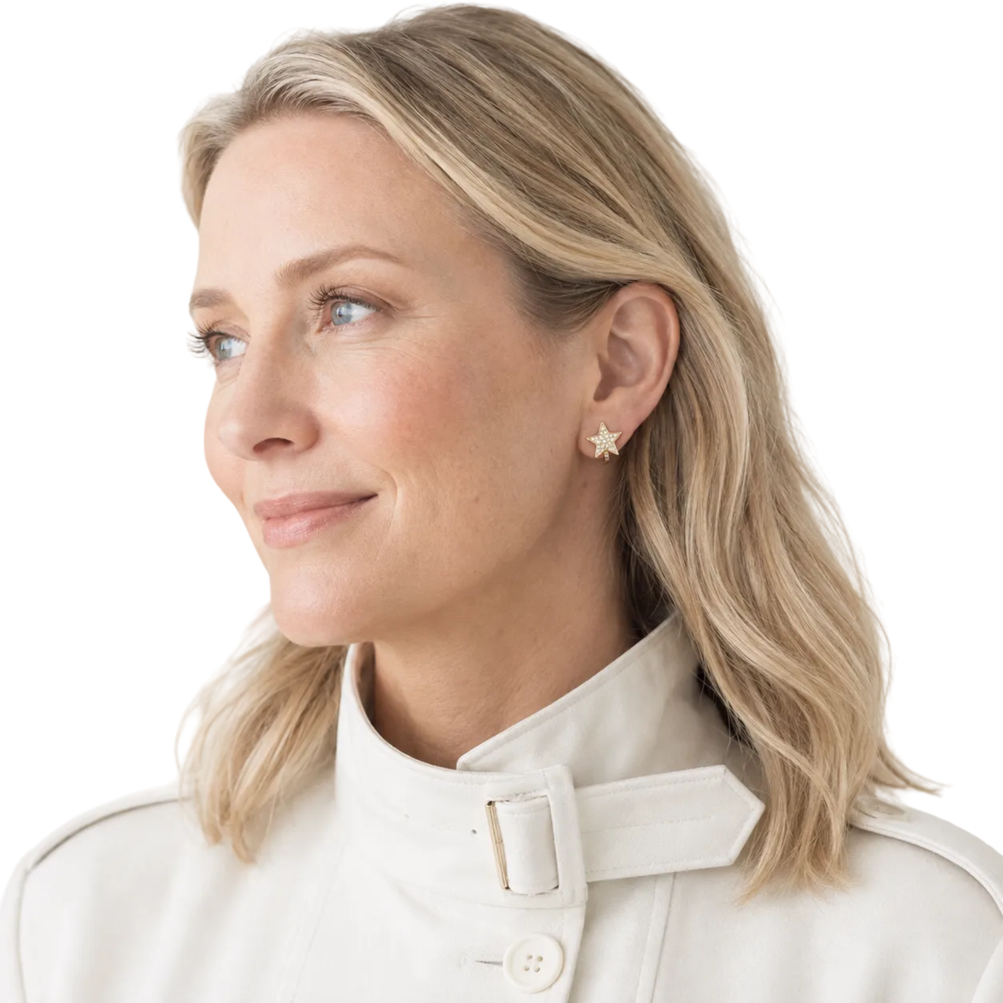 A close-up portrait of a woman with blonde hair wearing a cream-colored high-neck jacket and a small gold star-shaped stud earring, set against a soft, light beige background.