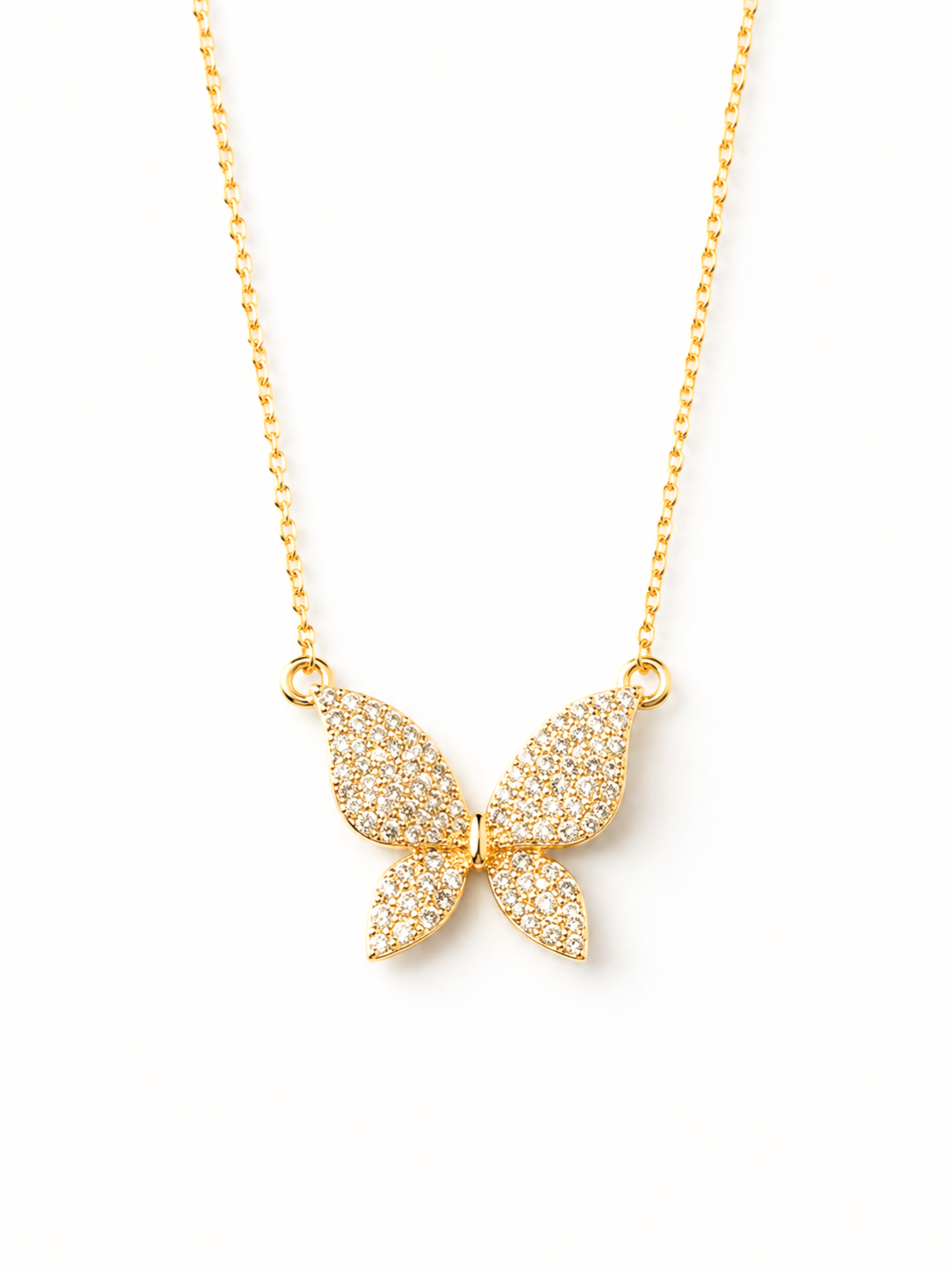 A gold butterfly pendant necklace paved with small clear stones, suspended from a delicate gold chain against a clean white background.