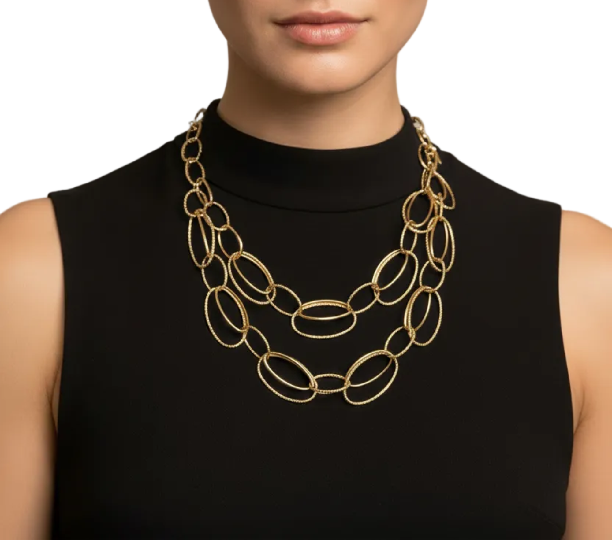 A woman with dark hair pulled back wears a black sleeveless mock-neck top and a chunky gold multi-strand oval-link necklace against a plain white background.