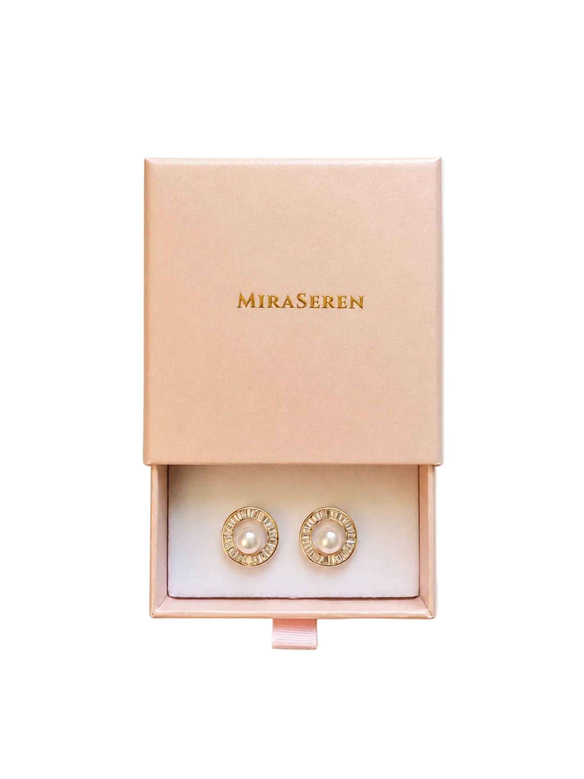 A pair of gold stud earrings with white pearls in the center, presented in a pink Miraseren jewelry box on a light beige background.