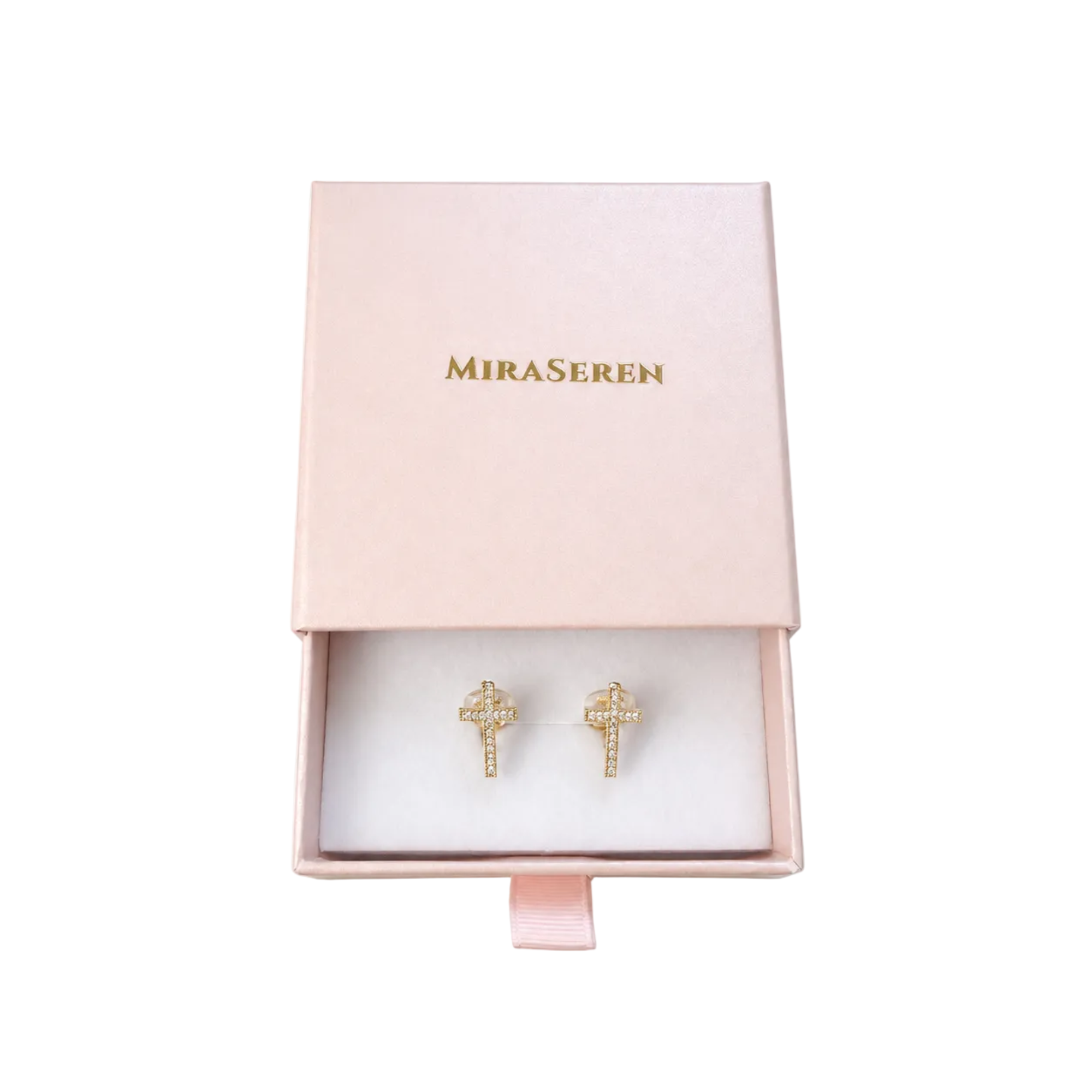 A pair of gold cross stud earrings displayed inside an open light pink jewelry box with the brand name 'MiraSeren' printed in gold on the lid, set against a plain white background.