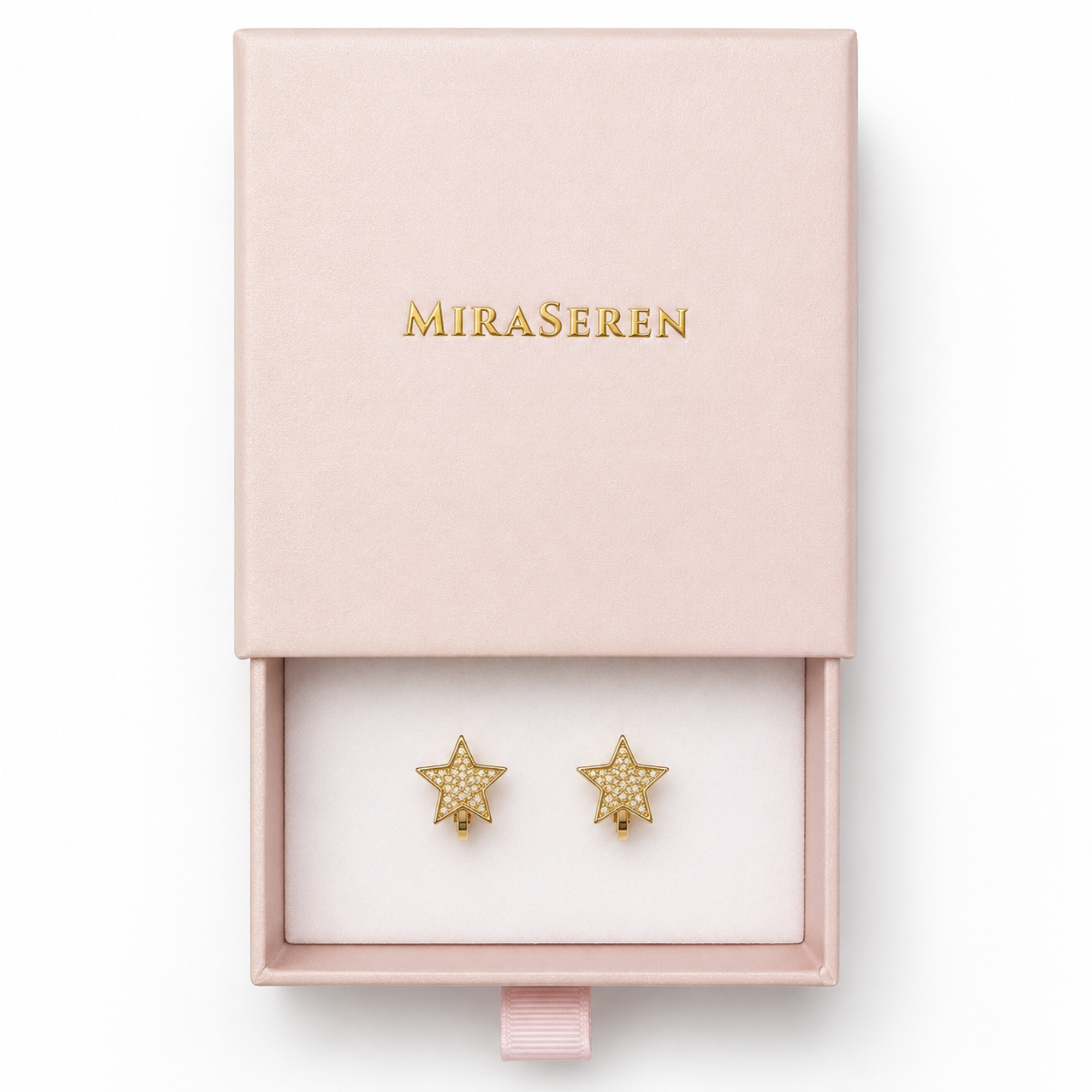 A pair of gold star-shaped stud earrings displayed in an open pale pink Miraseren jewelry box with a pink lid featuring gold lettering.
