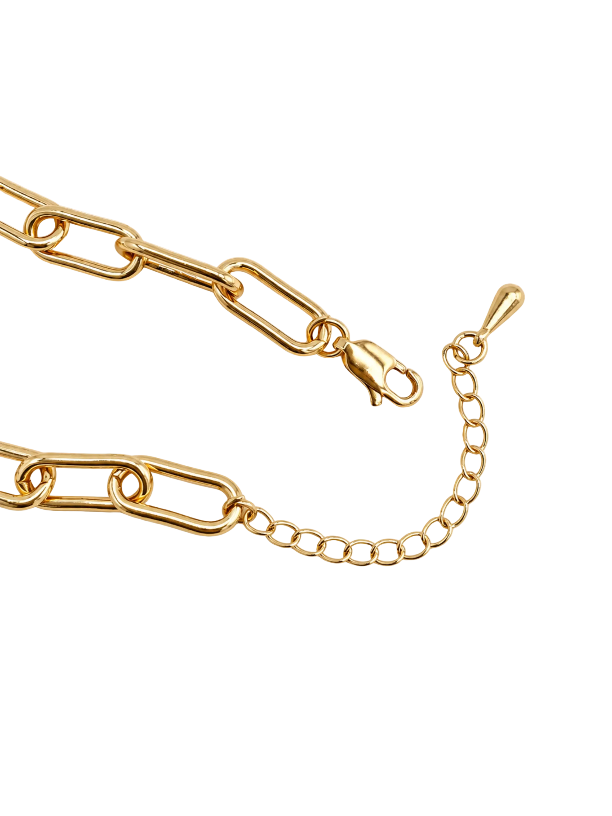 Gold paperclip chain necklace with a lobster clasp and extender chain, photographed on a light cream background.