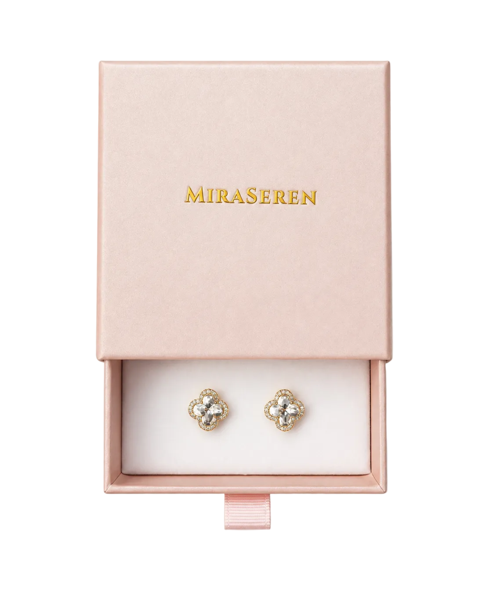 A pair of gold four-leaf clover stud earrings with clear crystals, presented in a pink Miraseren jewelry box.
