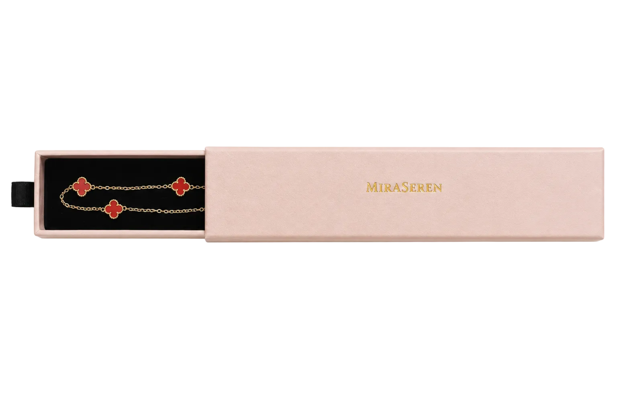 A gold chain bracelet with red clover motifs displayed inside an open pale pink Miraseren gift box, shown against a solid white background.