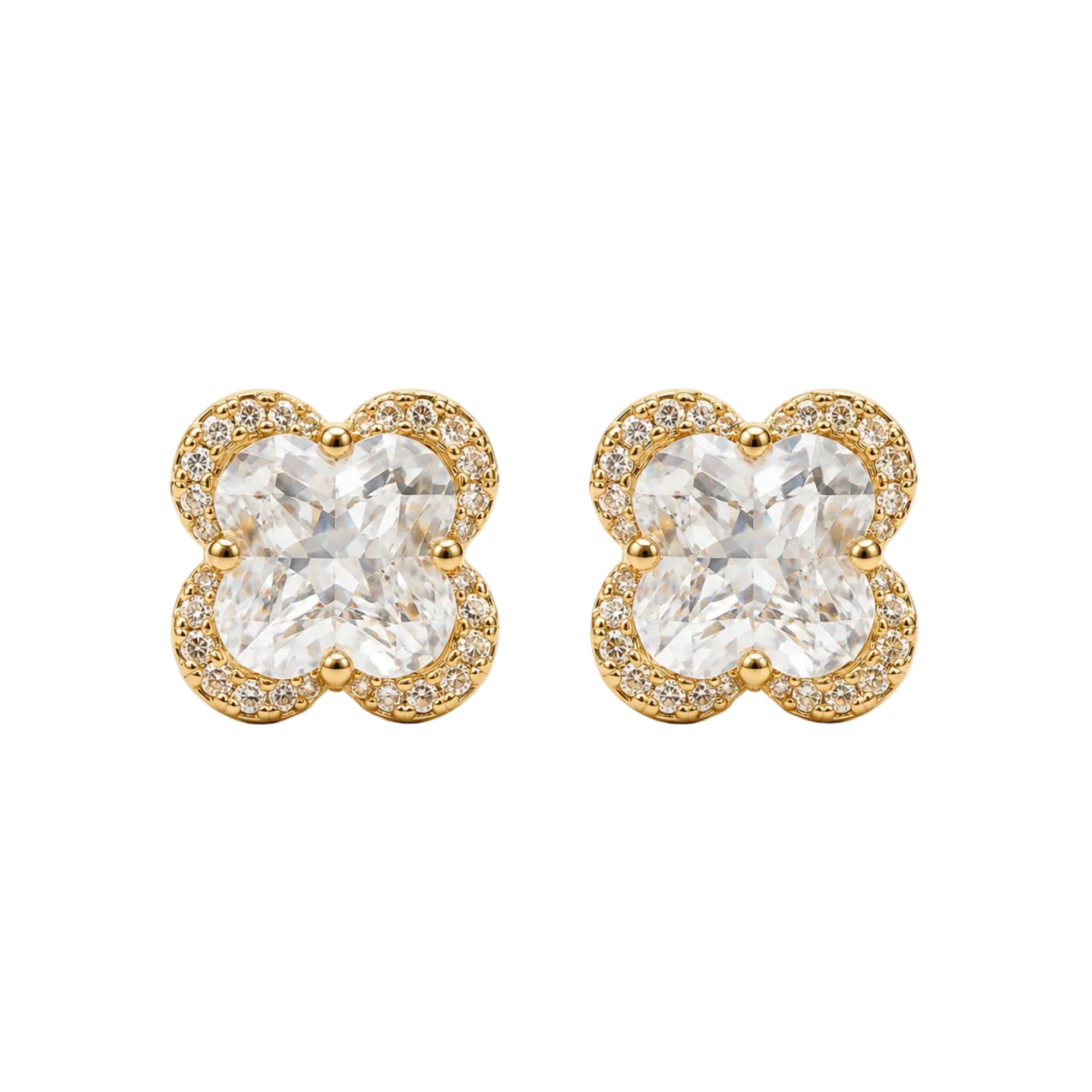 A pair of gold four-leaf clover stud earrings with clear round-cut center stones and a halo of small clear stones, shown on a plain white background.